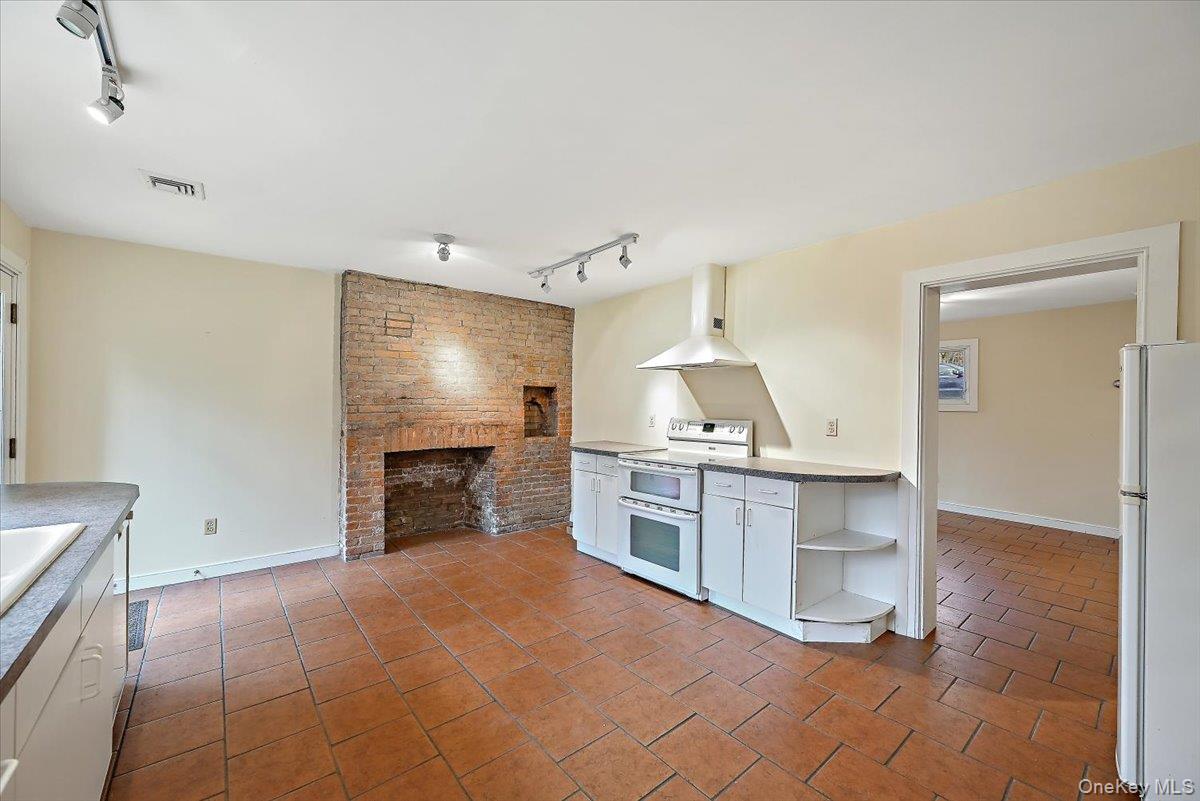 948 Craigville Road Chester, NY 10918 - Photo 14 of 42 a open kitchen with refrigerator stove and cabinets