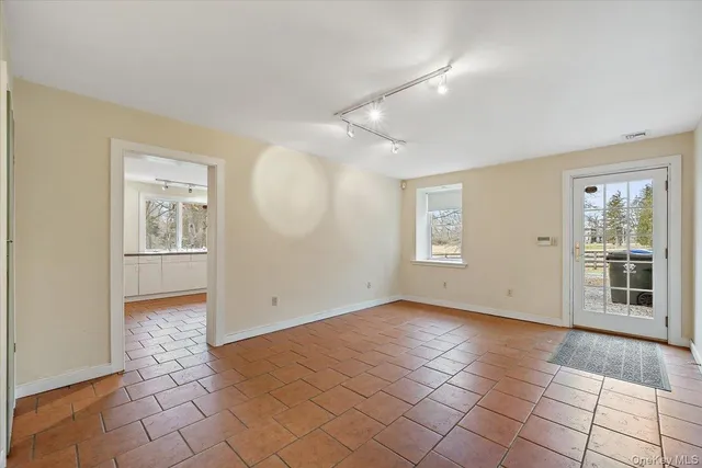 a view of an empty room with a window