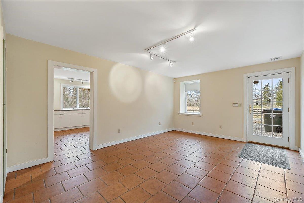948 Craigville Road Chester, NY 10918 - Photo 17 of 42 a view of an empty room with window and wooden floor