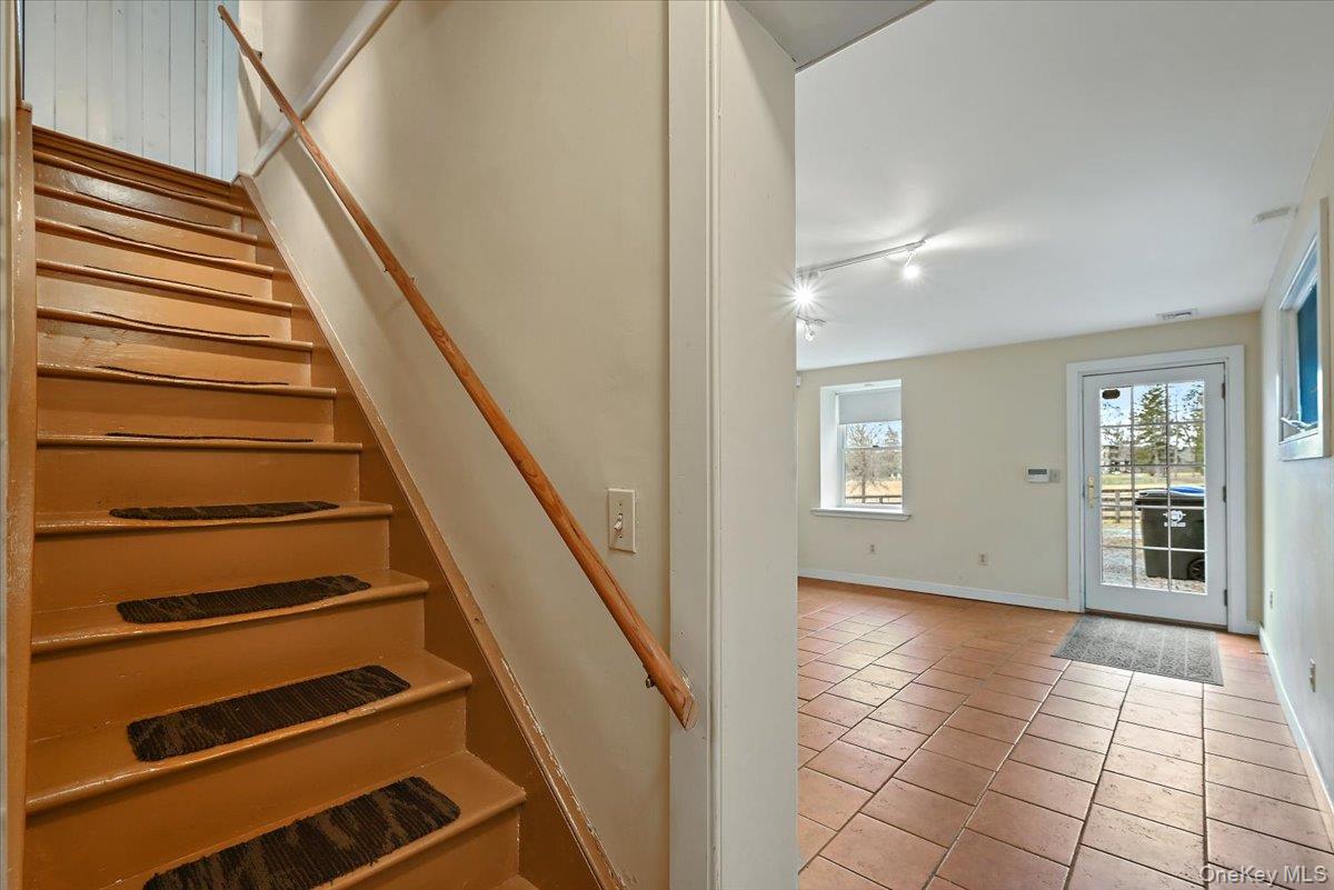 948 Craigville Road Chester, NY 10918 - Photo 20 of 42 a view of an entryway with wooden floor and stairs
