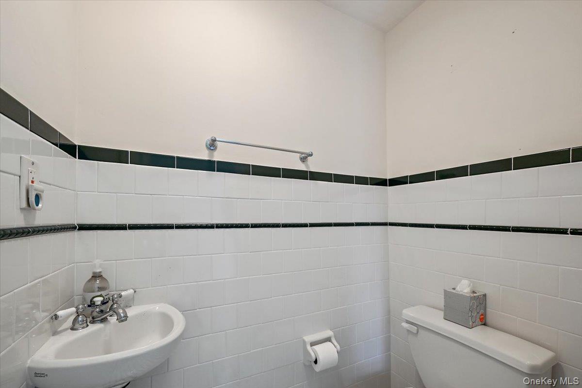 948 Craigville Road Chester, NY 10918 - Photo 31 of 42 a bathroom with a sink and a mirror