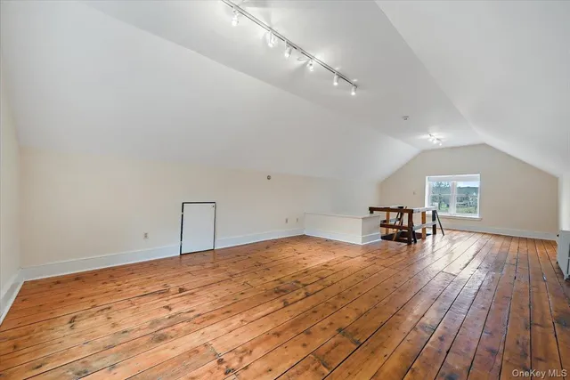 a front view of house with a yard and trees