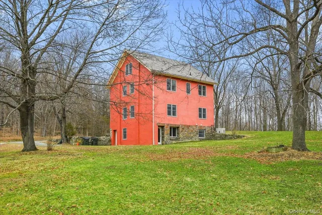 a huge green field with lots of trees