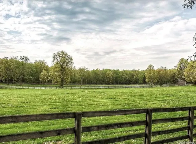a swimming pool with outdoor seating and patio
