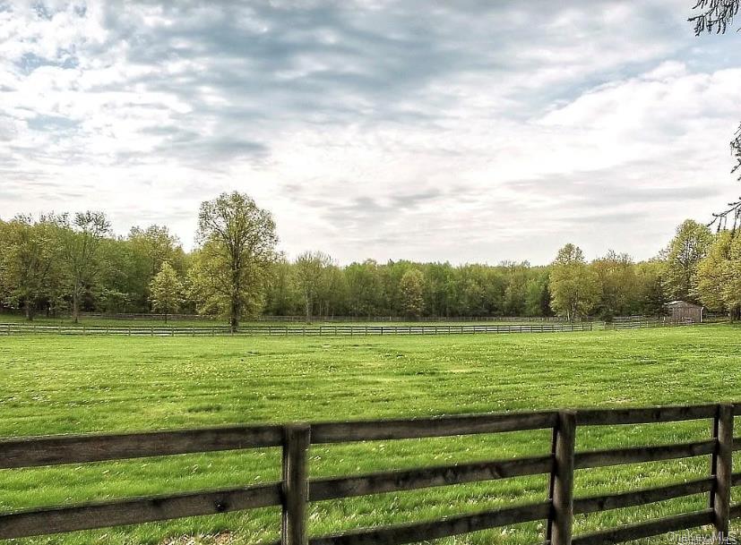 948 Craigville Road Chester, NY 10918 - Photo 40 of 42 a view of a grassy field with an trees