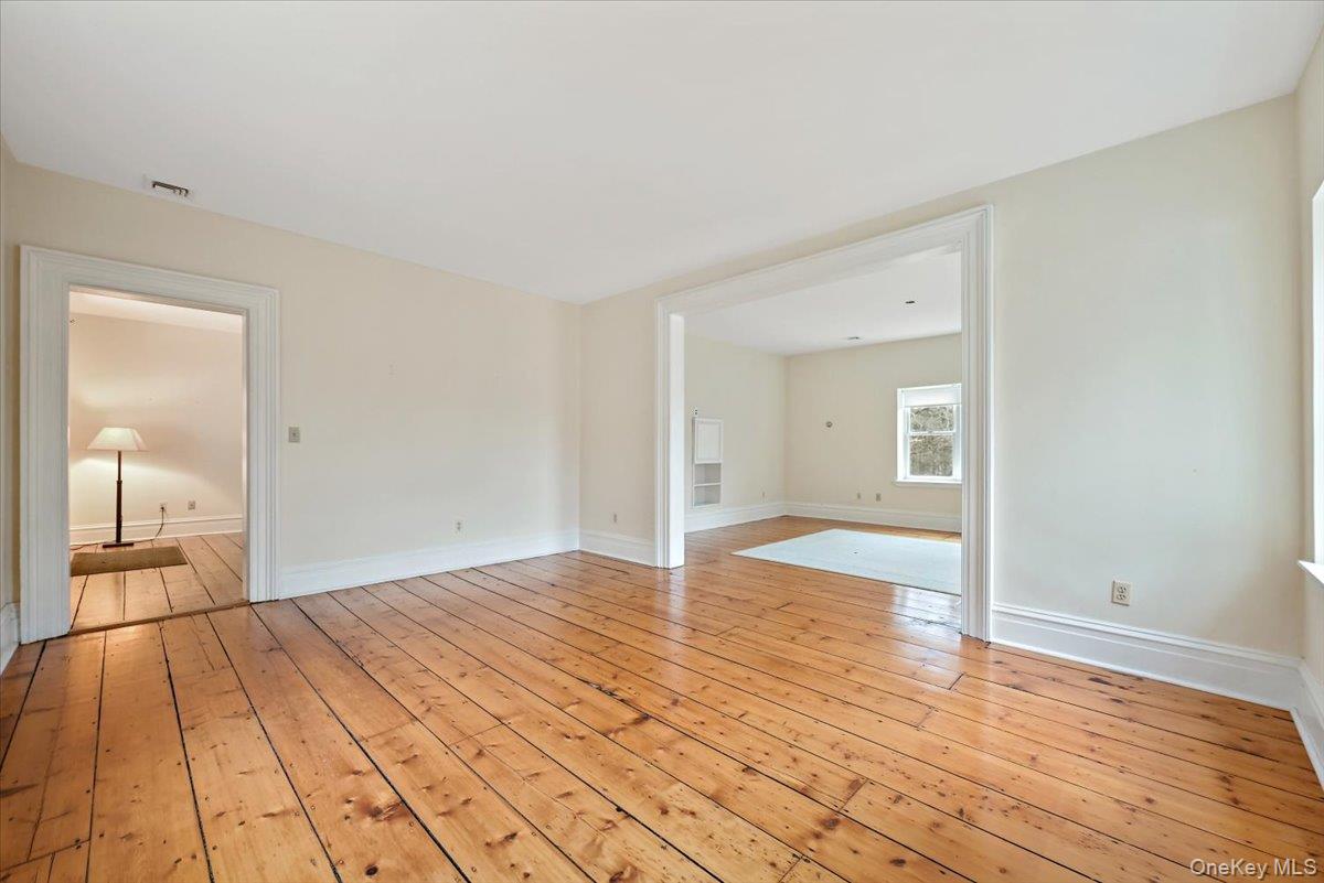 948 Craigville Road Chester, NY 10918 - Photo 10 of 42 a view of a room with wooden floor and a bathroom