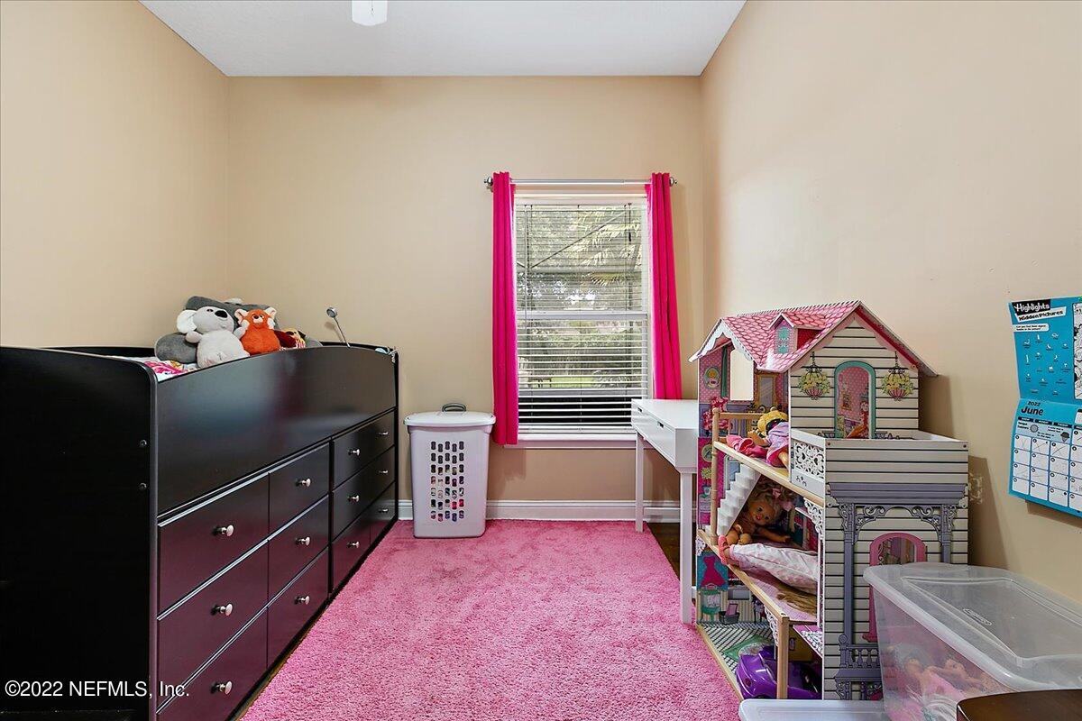 86003 Maple Leaf Place Yulee, FL 32097 - Photo 15 of 27 a view of a kitchen with fridge and workspace