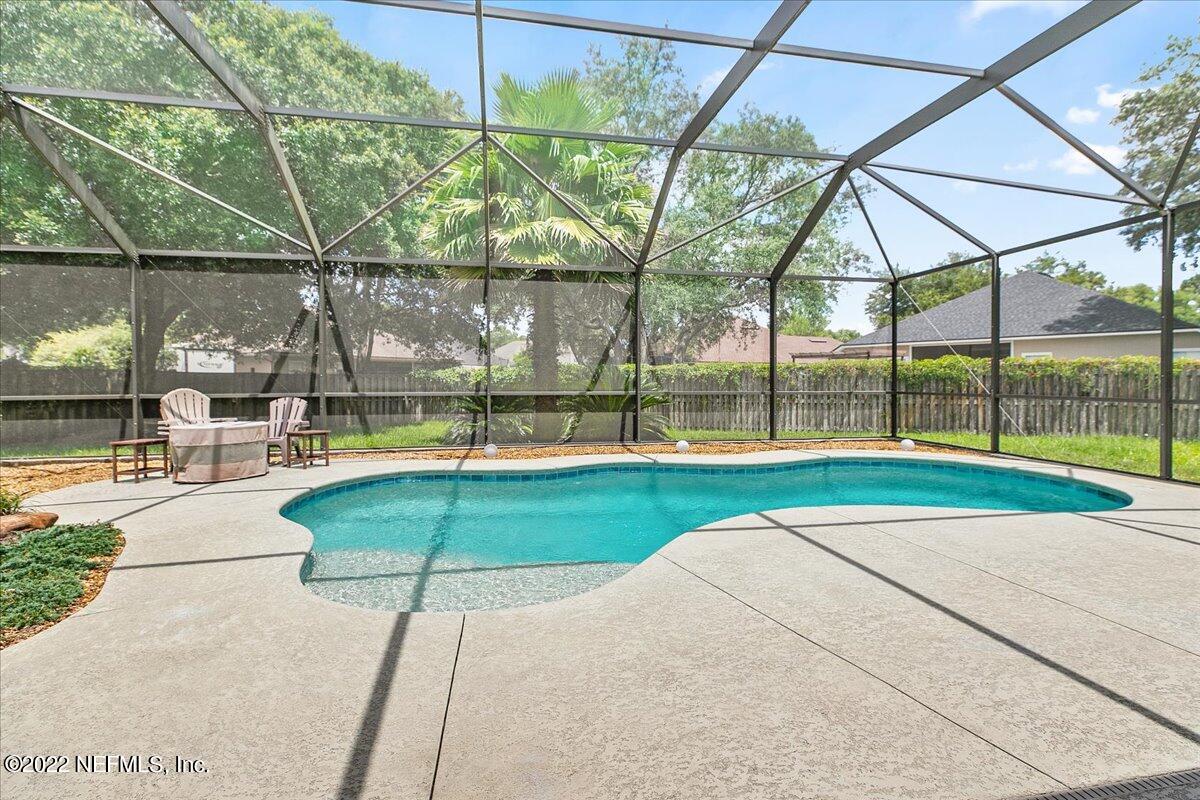 86003 Maple Leaf Place Yulee, FL 32097 - Photo 22 of 27 a view of yard with a play ground