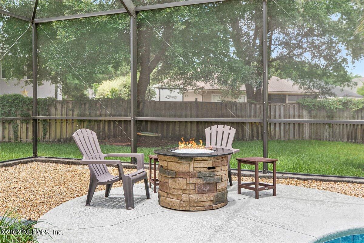 86003 Maple Leaf Place Yulee, FL 32097 - Photo 23 of 27 a view of a chairs and table in the back yard