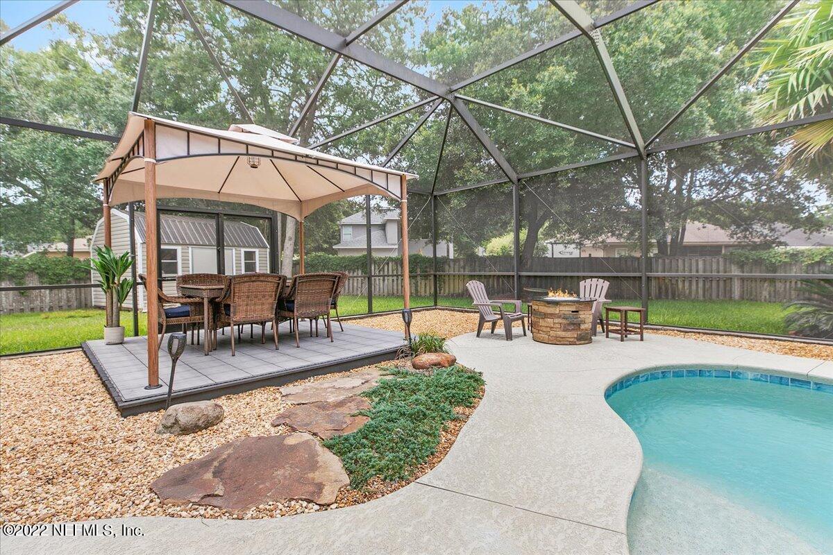 86003 Maple Leaf Place Yulee, FL 32097 - Photo 24 of 27 a view of a swimming pool with a patio