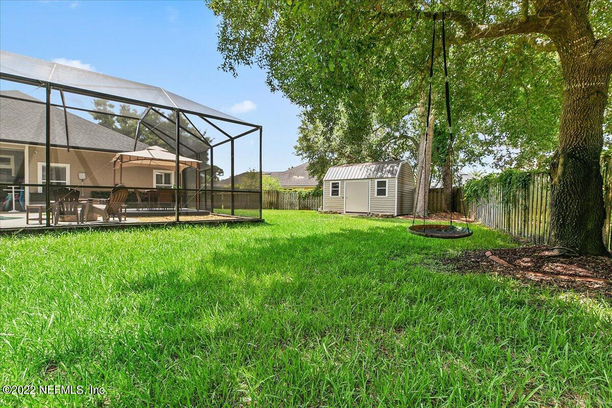 86003 Maple Leaf Place Yulee, FL 32097 - Photo 26 of 27 a view of a house with a yard deck and sitting area