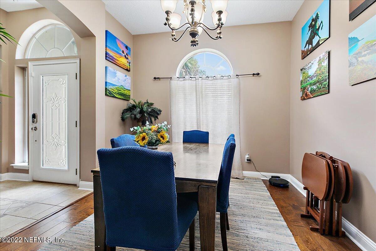 86003 Maple Leaf Place Yulee, FL 32097 - Photo 5 of 27 a view of a dining room with furniture window and wooden floor