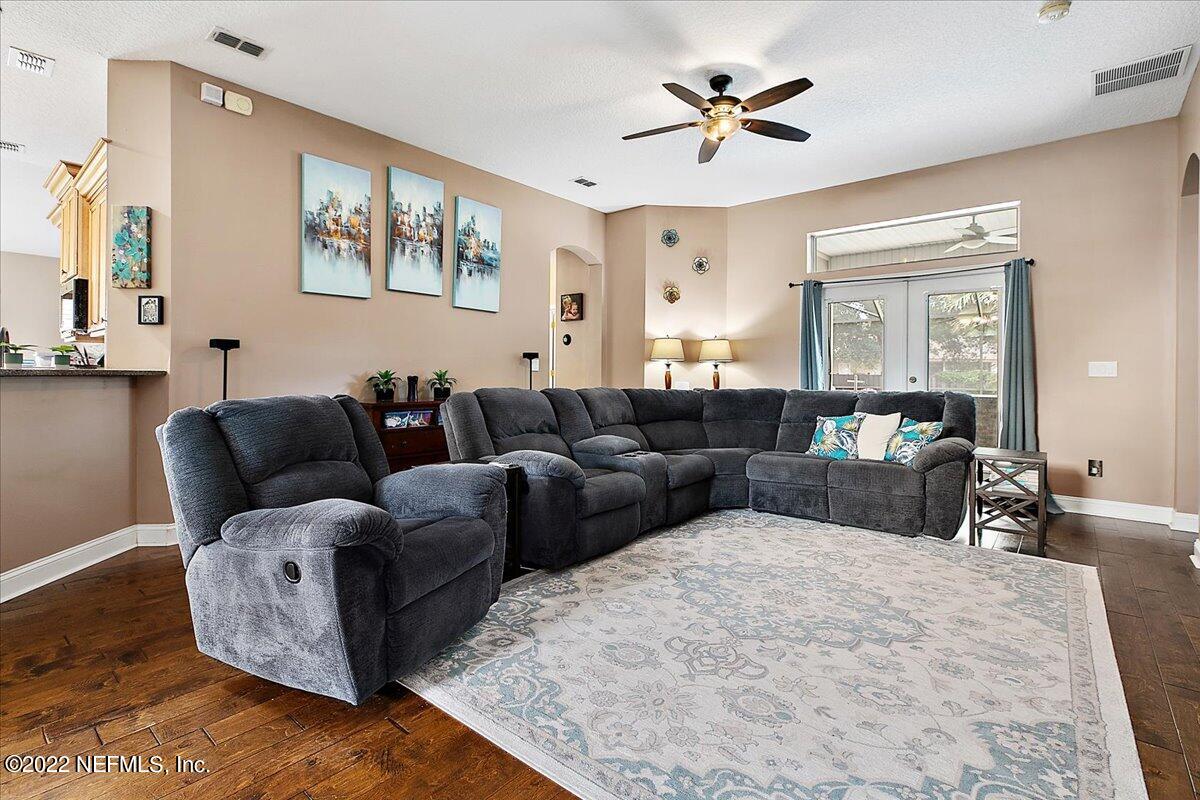 86003 Maple Leaf Place Yulee, FL 32097 - Photo 8 of 27 a living room with furniture ceiling fan and a window