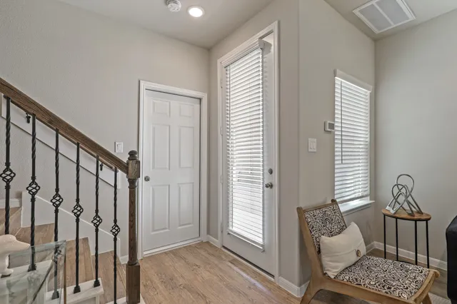 a bedroom with furniture and a window