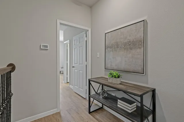 a view of an entryway with wooden floor