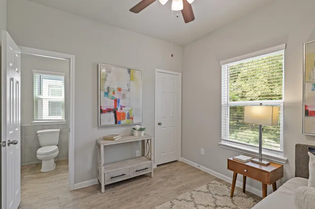 a view of room with workspace and windows