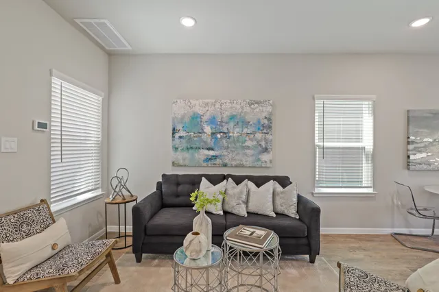 a living room with furniture and a window