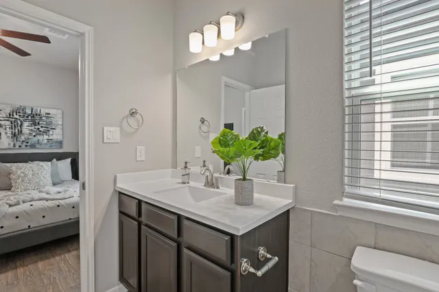 a view of a dining room with furniture and a chandelier