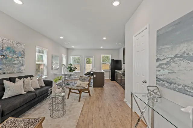 a living room with furniture or couch and a wooden floor