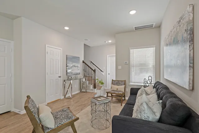 a living room with furniture and a large window