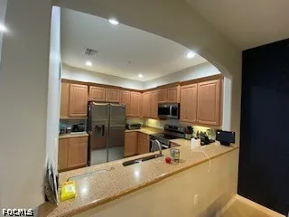a living room with furniture and a mirror