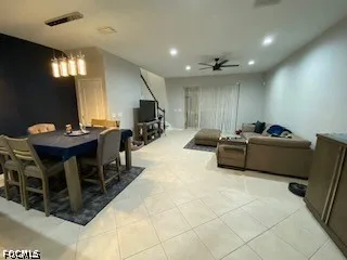 a room with furniture pool table gym equipment and a mirror