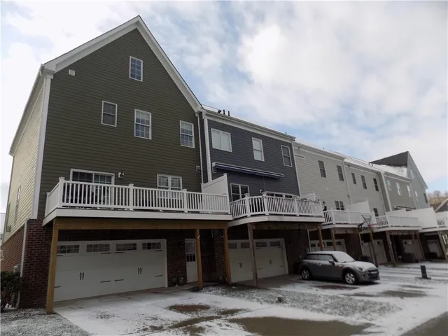 a balcony with table and chairs