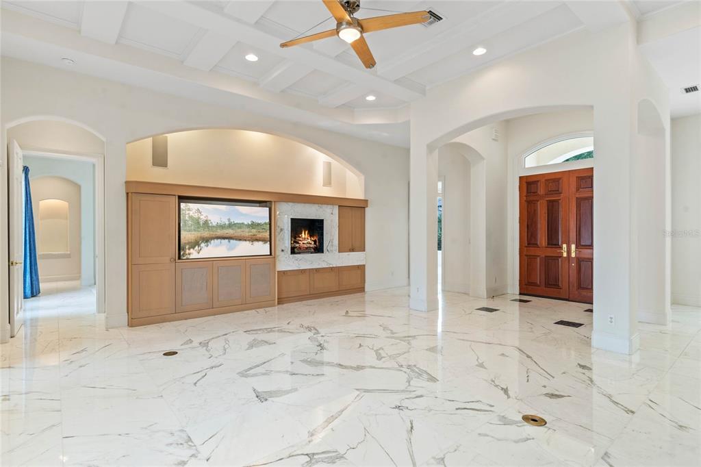 9701 Lake Isleworth Court Windermere, FL 34786 - Photo 28 of 31 a view of a hallway with wooden floor and a living room