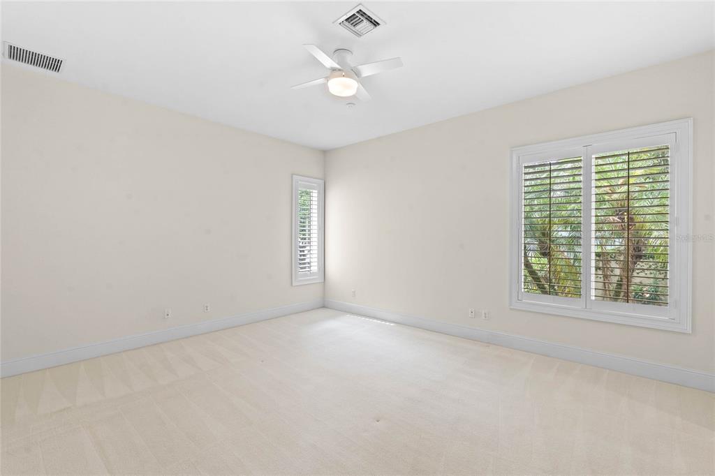 9701 Lake Isleworth Court Windermere, FL 34786 - Photo 3 of 31 an empty room with a window and a ceiling fan