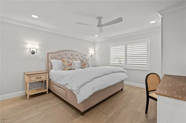 a bedroom with bed and a window