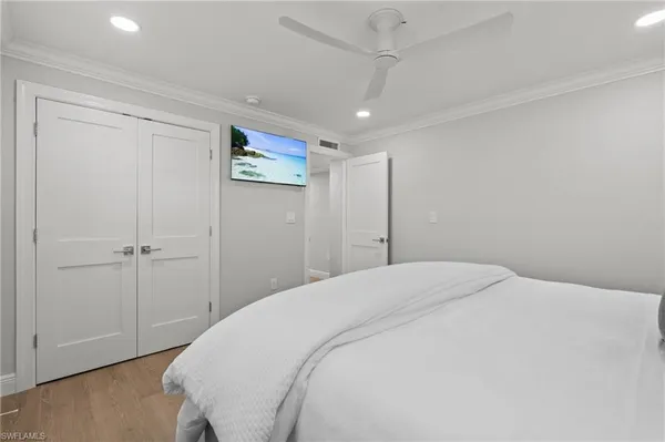 a spacious bedroom with a bed and a table