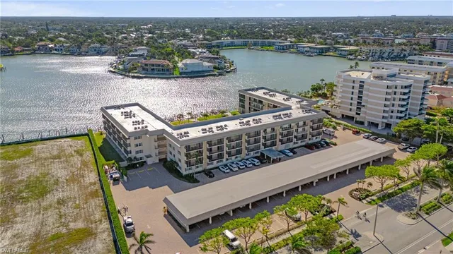 an aerial view of a house with a lake view