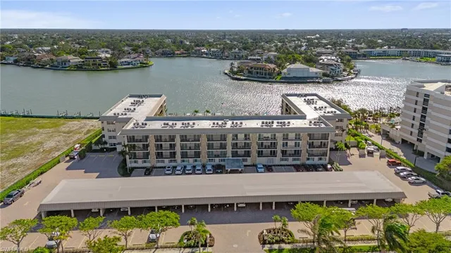 an aerial view of a house with a lake view