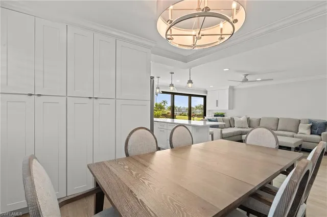 a living room with furniture a table and chairs