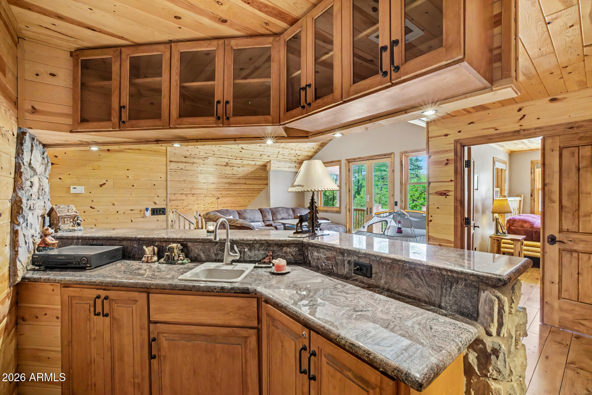 1681 South Jimson Loop Show Low, AZ 85901 - Photo 64 of 105 a kitchen with a sink and a wooden cabinets