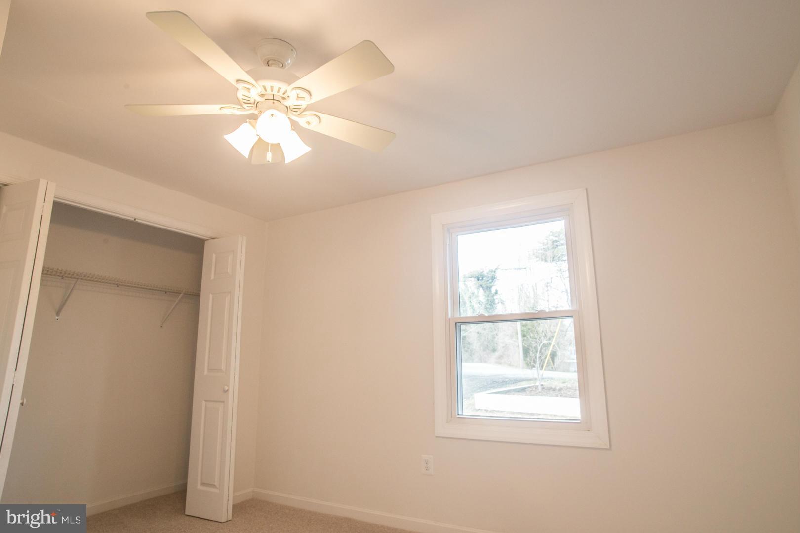 1995 Sixes Road Prince Frederick, MD 20678 - Photo 22 of 30 an empty room with windows and fan
