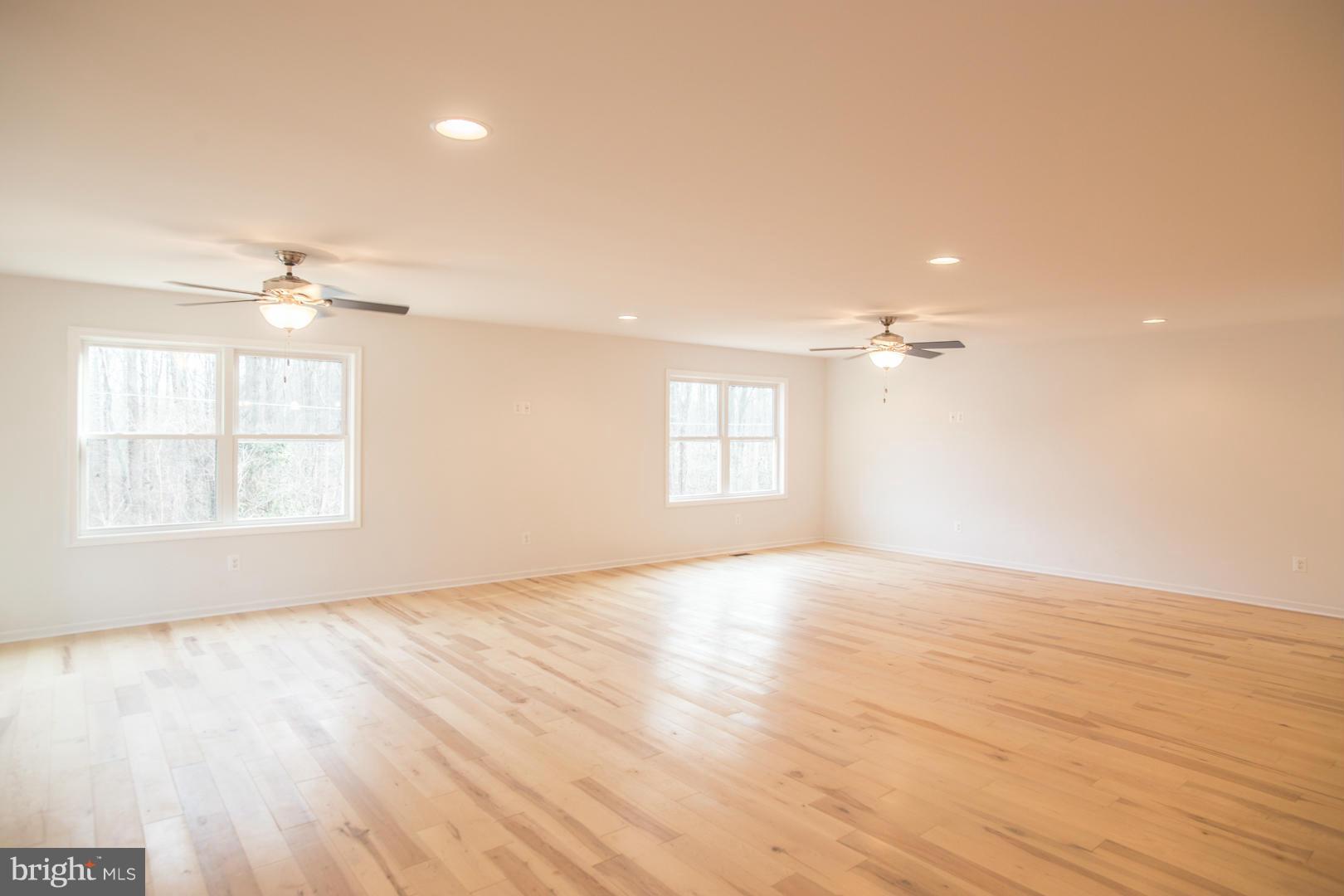 1995 Sixes Road Prince Frederick, MD 20678 - Photo 5 of 30 an empty room with wooden floor and windows