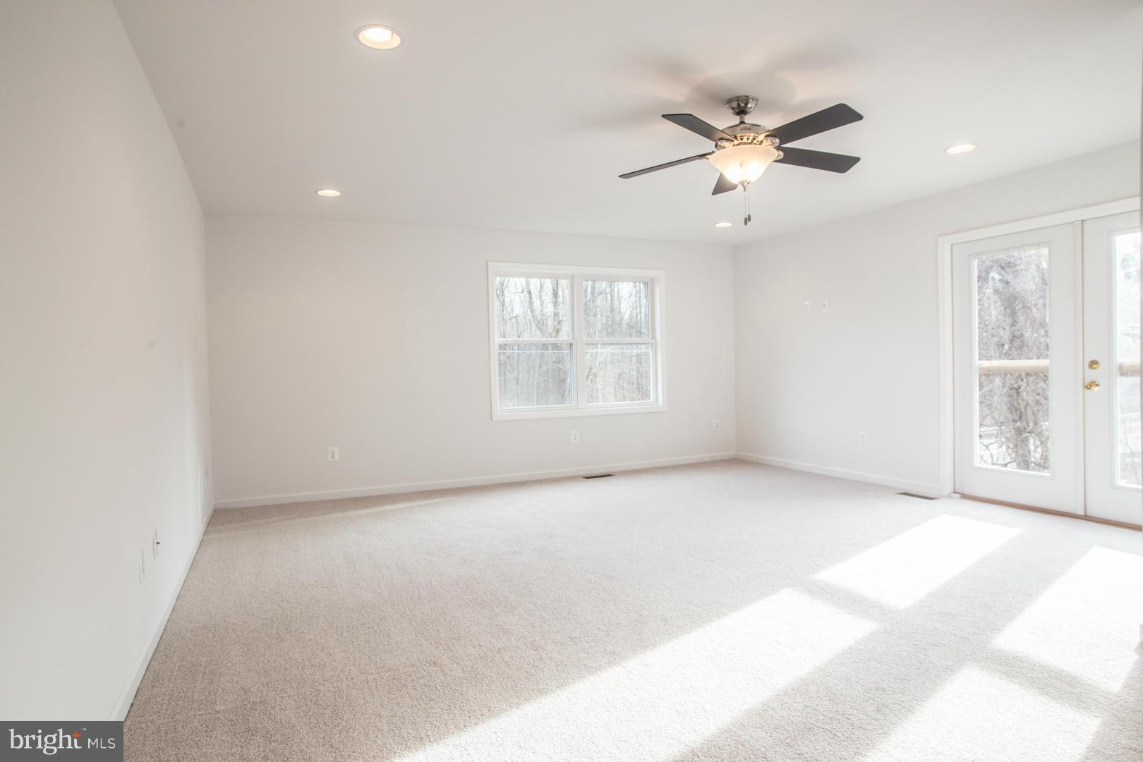 1995 Sixes Road Prince Frederick, MD 20678 - Photo 6 of 30 an empty room with windows and fan
