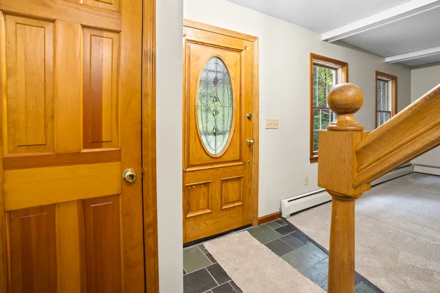 a bathroom with a granite countertop window and a shower