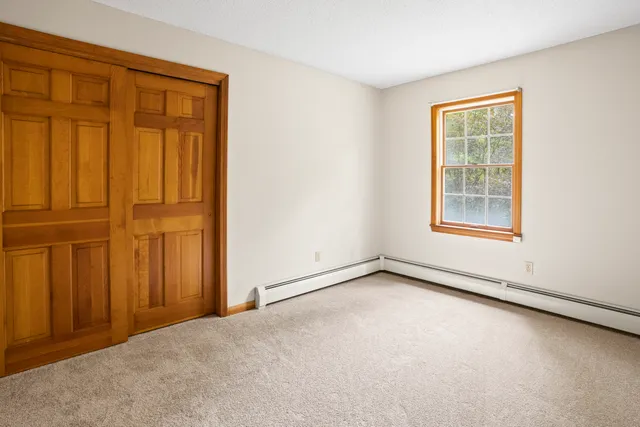 a view of a bathroom from a corridor