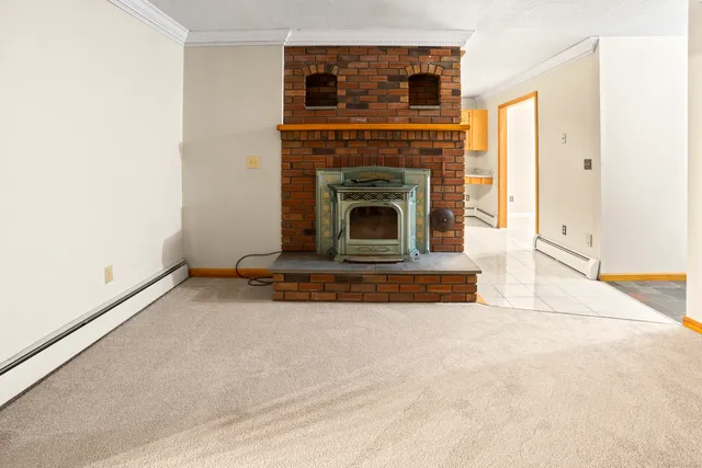 a view of fireplace and entryway in a room