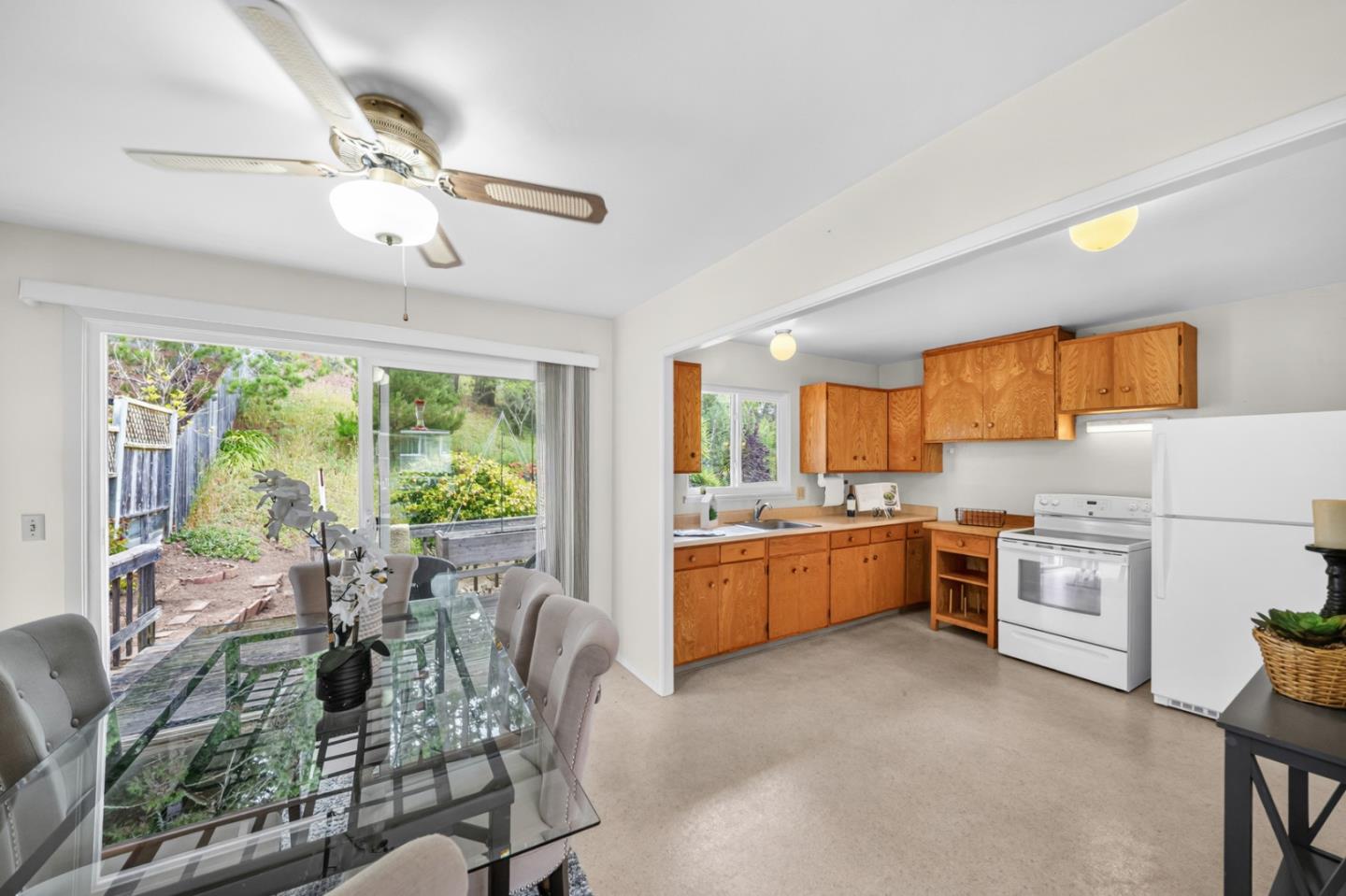 1287 Lerida Way Pacifica, CA 94044 - Photo 26 of 52 a large kitchen with a table chairs and refrigerator