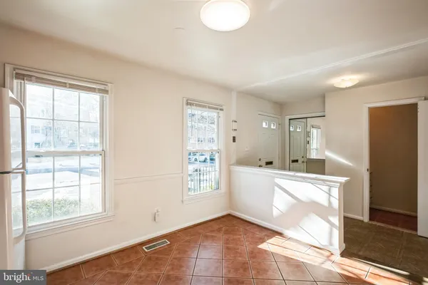 a view of a kitchen with furniture and windows
