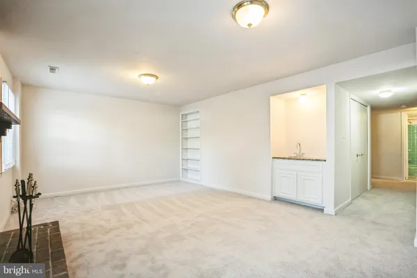 an empty room with a empty space and windows