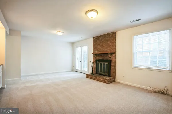 an empty room with fireplace