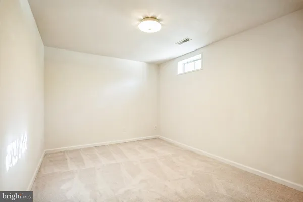 an empty room with a empty space and window