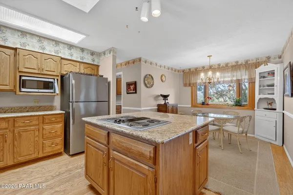 a view of a livingroom with furniture and a window