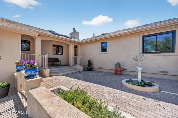a view of a livingroom with furniture and a flat screen tv