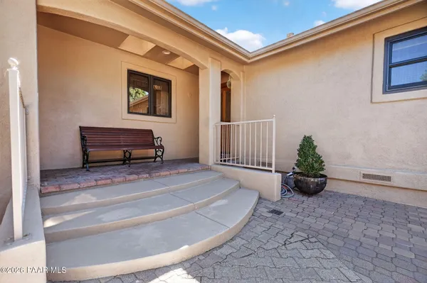 a kitchen with granite countertop a sink stove and cabinets