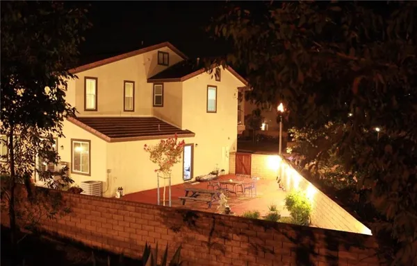 a front view of house with yard outdoor seating and kitchen